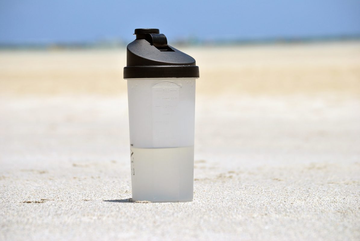 water bottle in sand