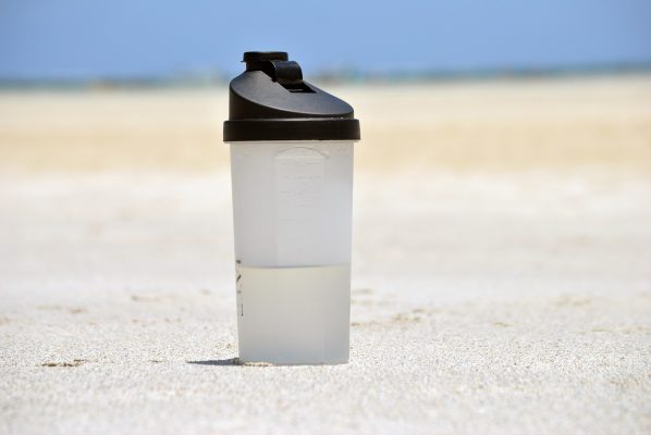 water bottle in sand