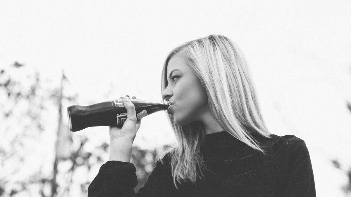 woman drinking soda