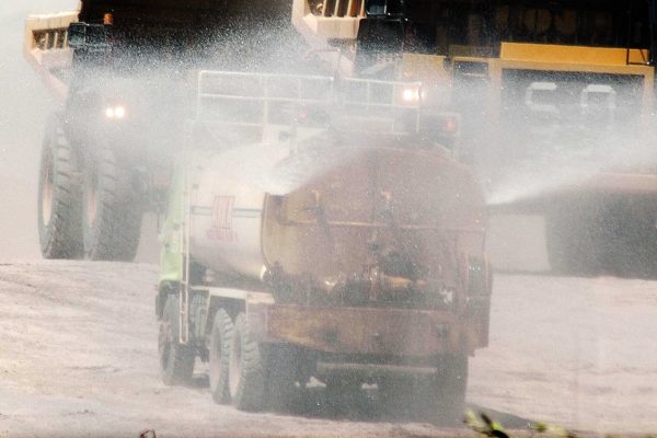water truck spraying roads