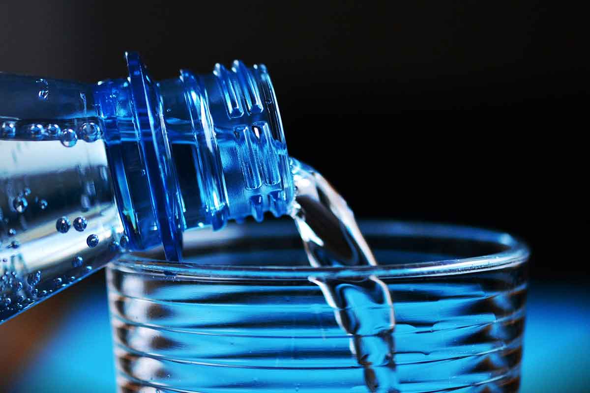 water bottle pouring into glass