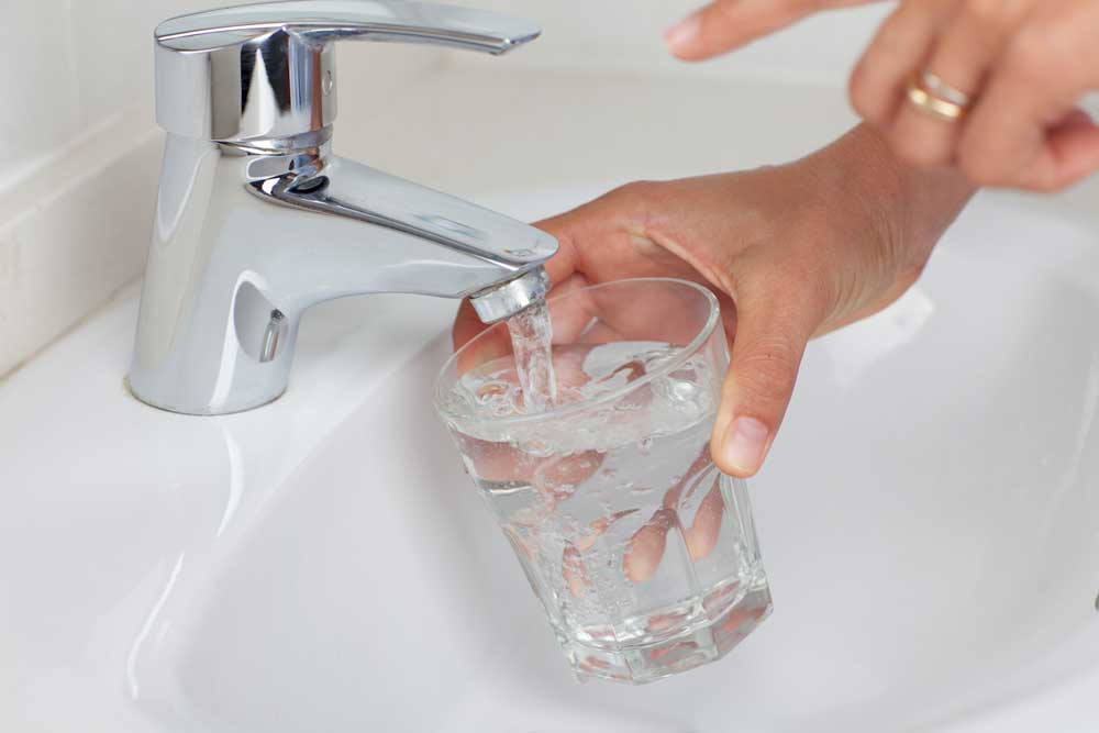 tap water coming out of the faucet