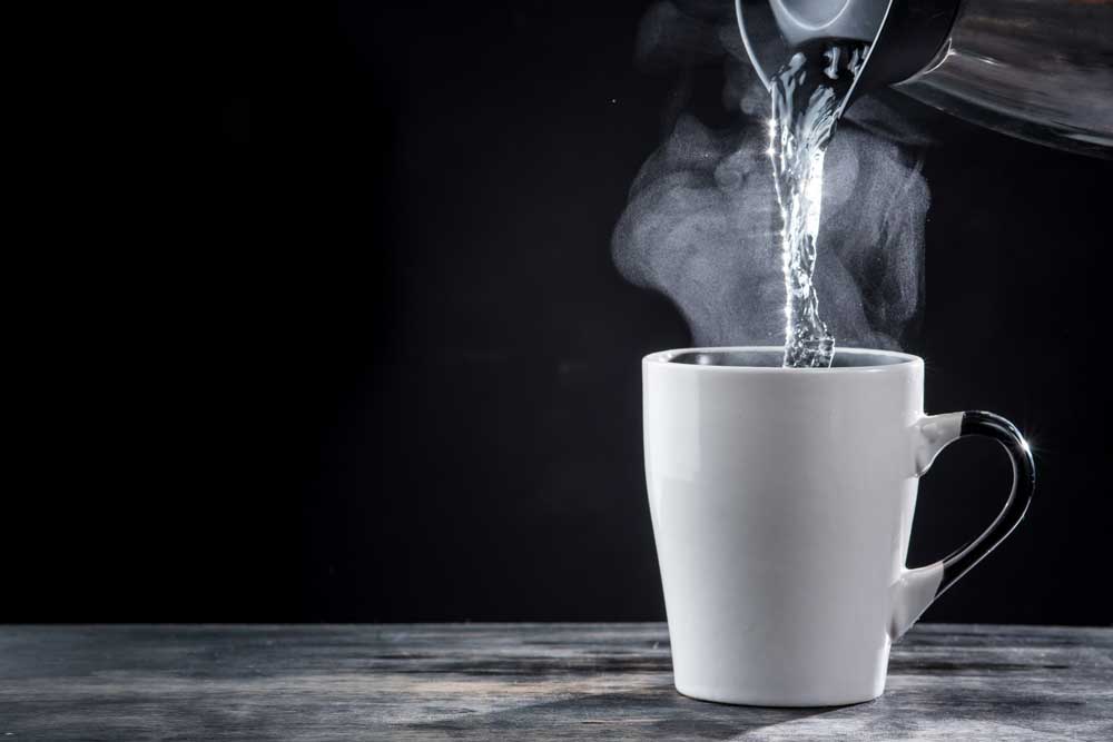hot water pouring into cup