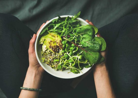 bowl of vegan food with lots of greens