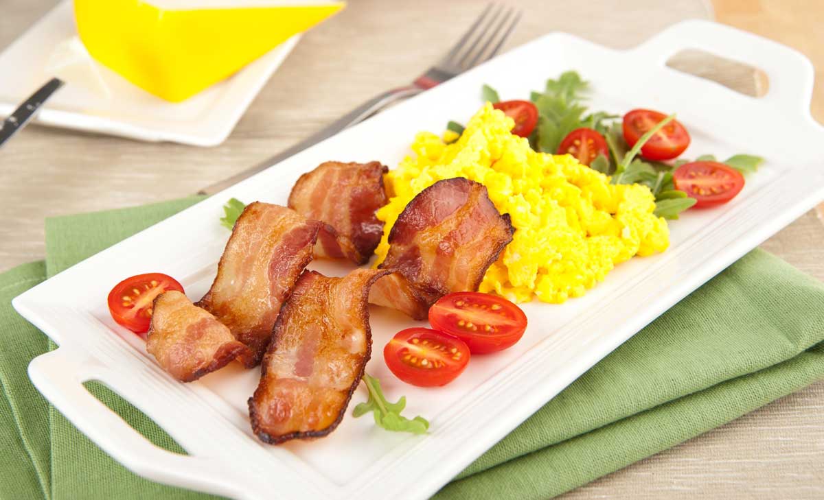 eggs and bacon on a plate in the morning