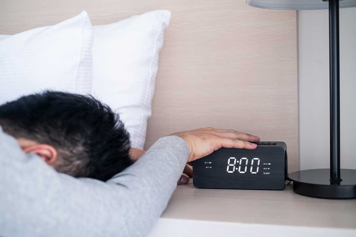 Snoozing the Alarm to Sleep Off Hangover