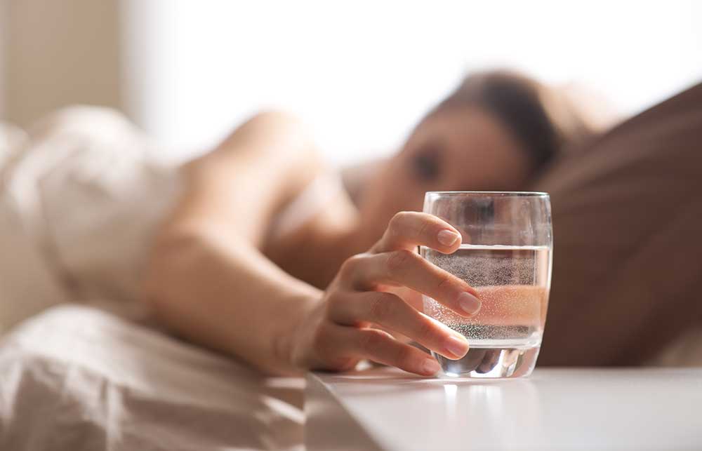 Female grabbing for water in the morning