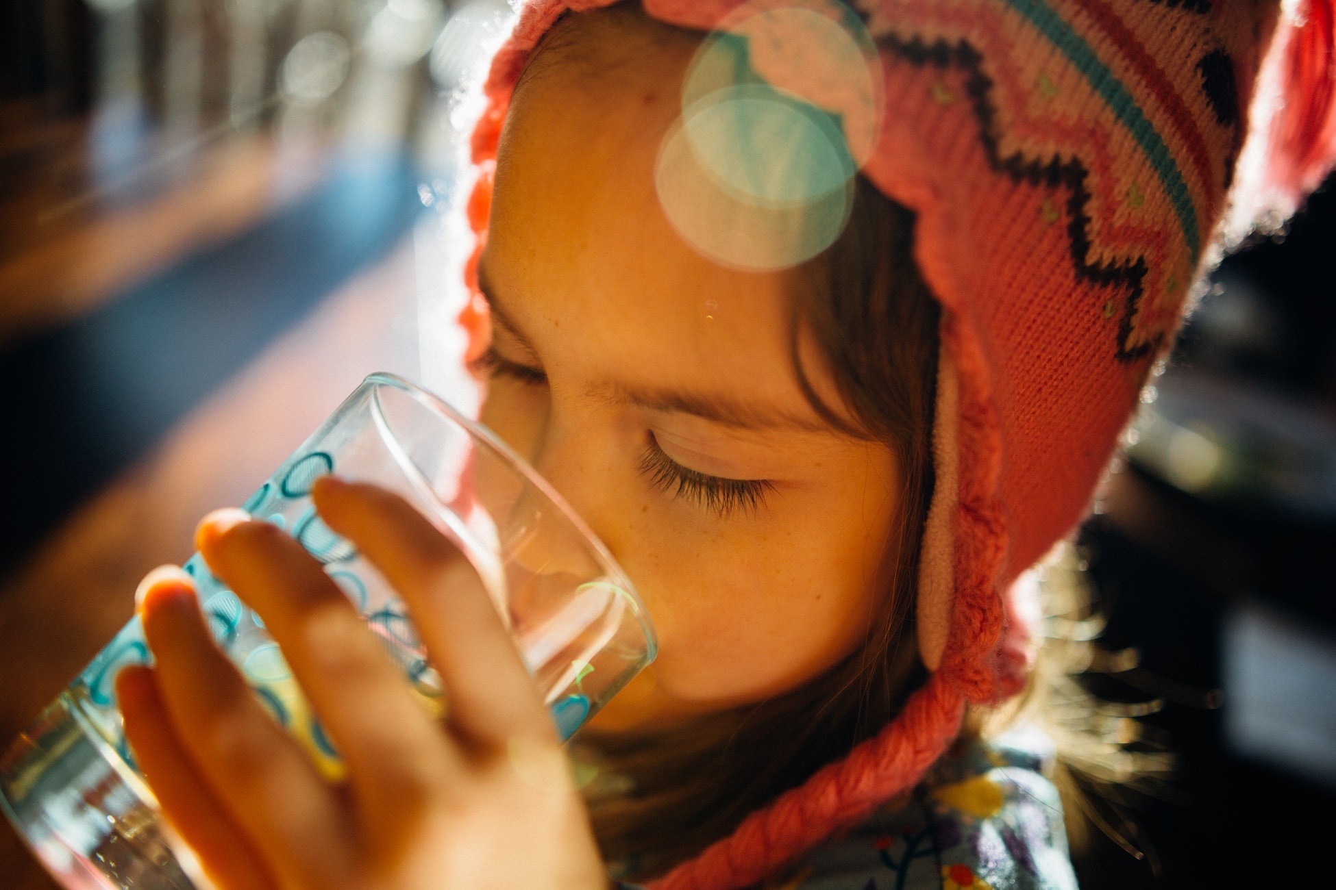 girl drinking glass of water